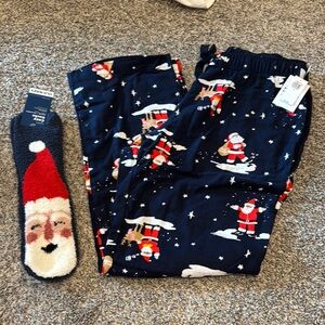 Old Navy Blue and Red Pajama Bottoms with Festive Santa Design and cozy socks